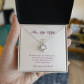 Personalized To My Wife necklace held in hand — gift box open