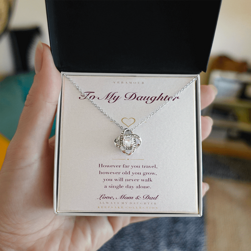 Personalized To My Daughter necklace held in hand — gift box open