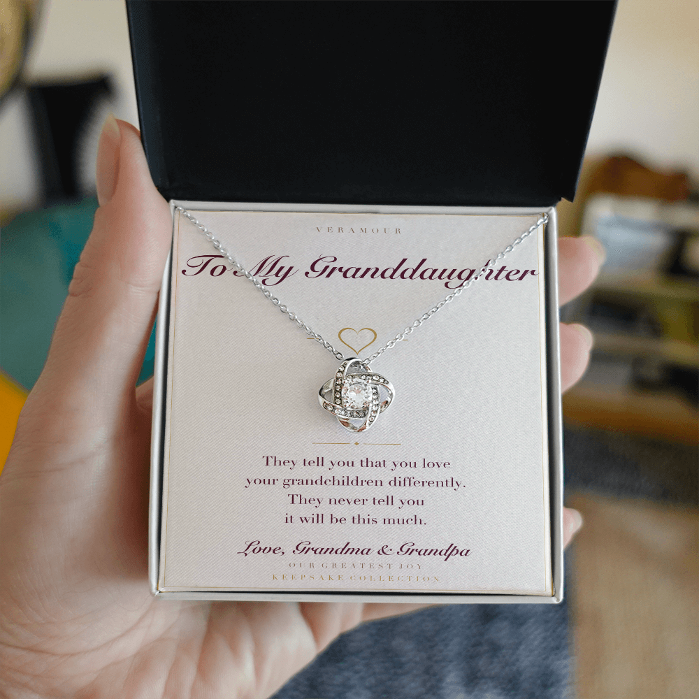 Personalized To My Granddaughter necklace held in hand — gift box open